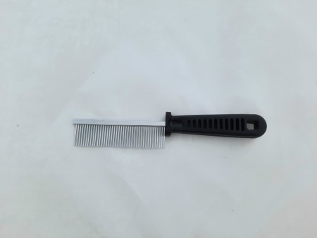 Liten pelsbørste i metall