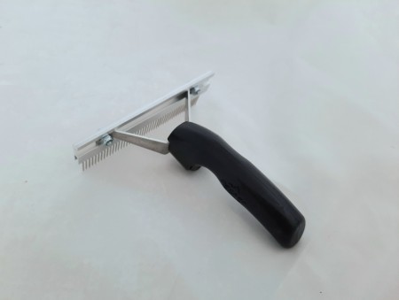 Stor pelsbørste i metall